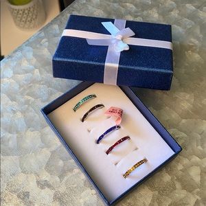 Five multi colored stone rings size